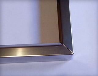 Stainless Steel Fabrication of a Cosmetic Door Trim for the Consumer Appliance Industry